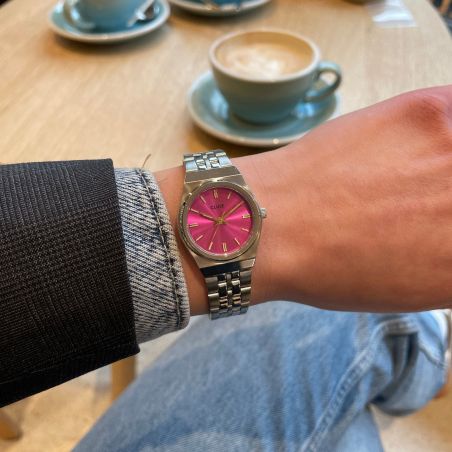 Montre femme cluse retro 70s mini ronde argentée cadran fuchsia aiguilles dorées cw16303 – montres tendances